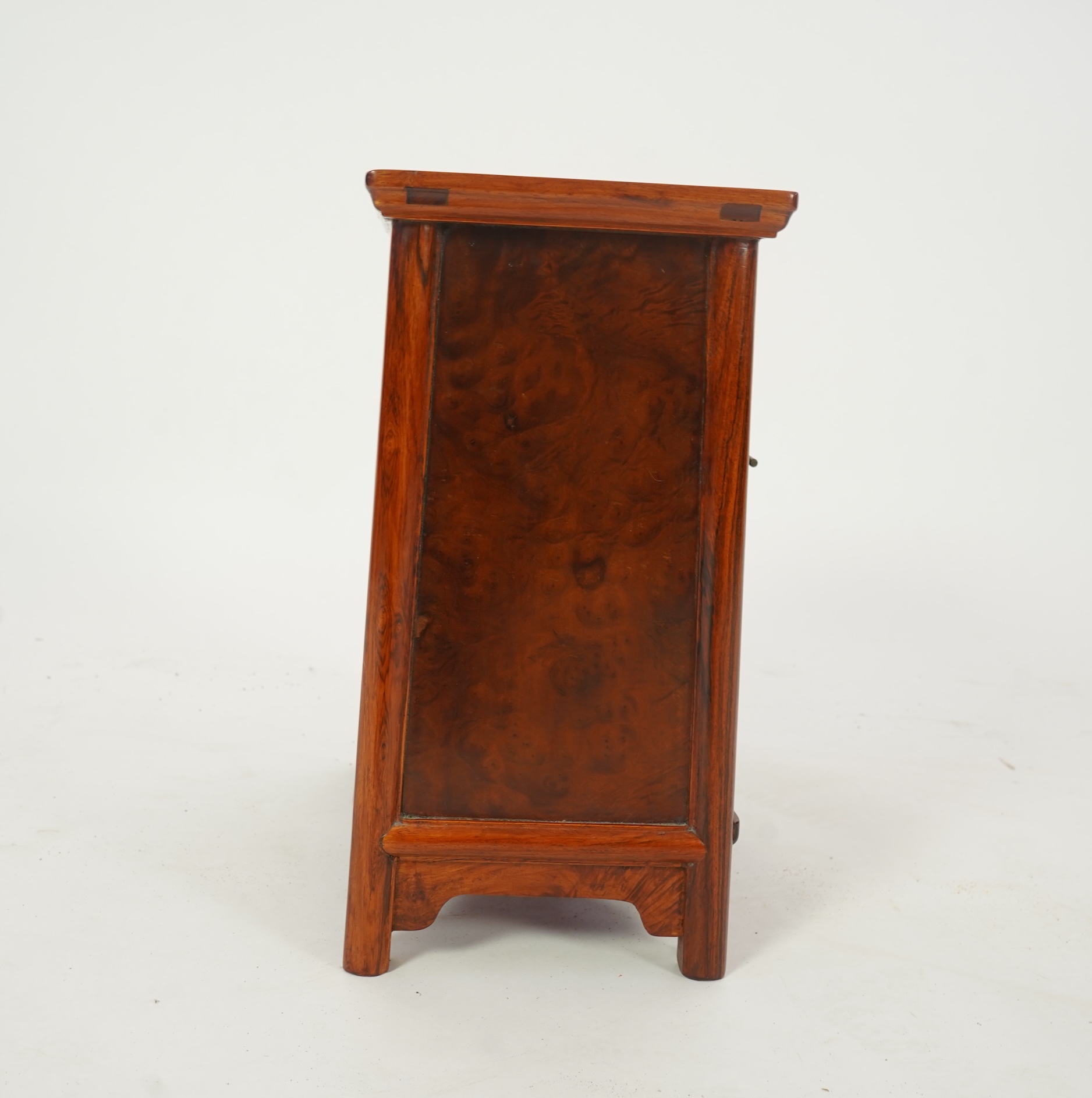 A Chinese huanghuali and burrwood panelled round-corner kang cabinet, 20th century